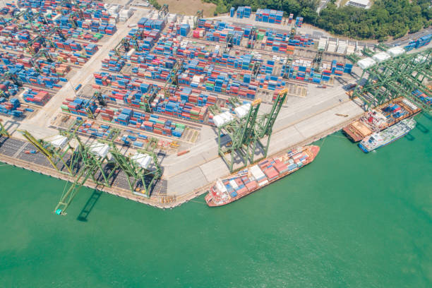 istock Container Cargo freight ship with working crane bridge in shipyard in singapore 1024145604