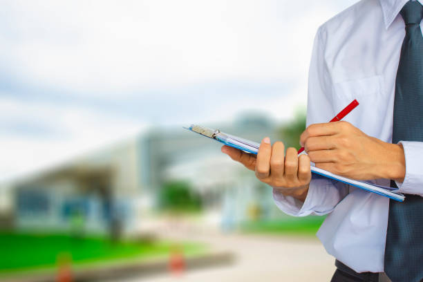 istock Male engineer inspection checking in factory With note on notepad or industry blurred background.Metaphor Quality inspection or Production speed For the best quality to customers. 1024150488