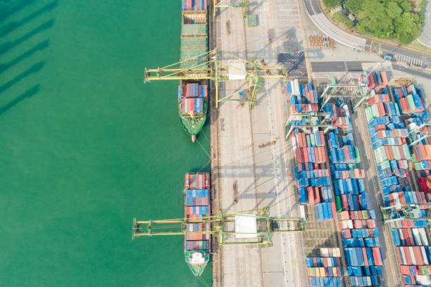 istock Container Cargo freight ship with working crane bridge in shipyard in singapore 1024150764