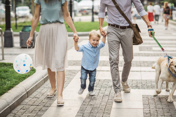 istock Family walking dog 1024155434