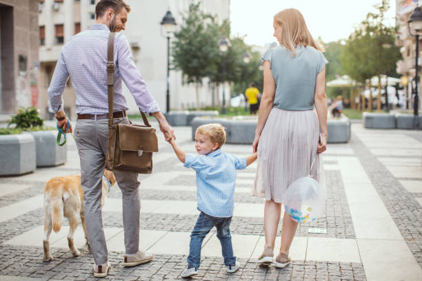 istock Family walking dog 1024155756
