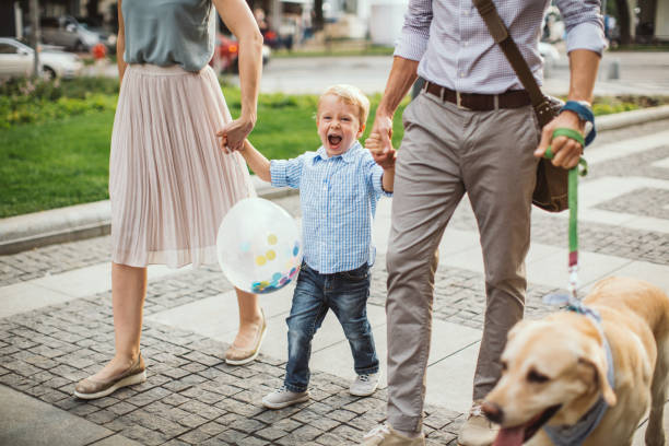 istock Family walking dog 1024155822