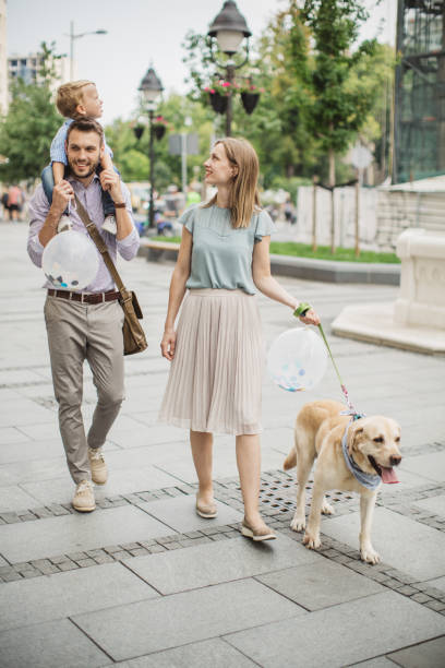 Family walking dog
