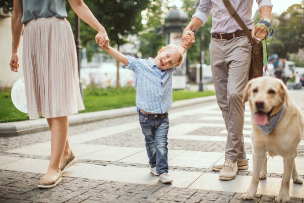 istock Family walking dog 1024156032