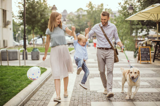 istock Family walking dog 1024156038