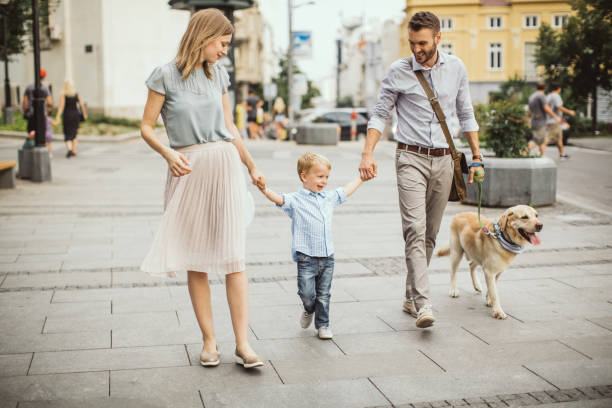 istock Family walking dog 1024156064