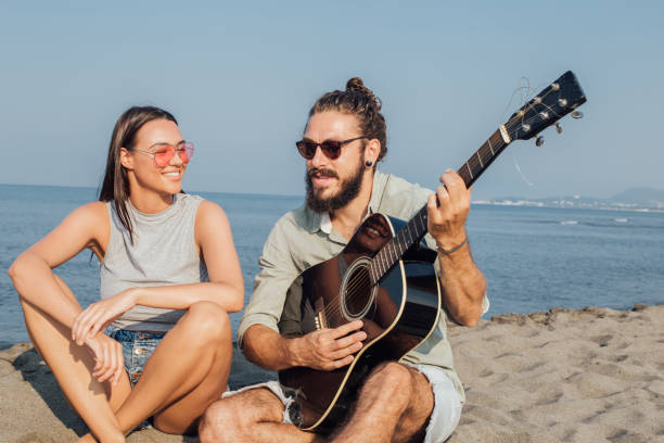 istock Happy young couple at the sunny beach 1024156558