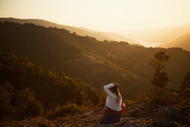 istock The Women İs Playing Guitar At The Sunset 1024167064