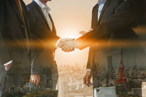 istock Double exposure Business People Handshake Meeting 1024173462