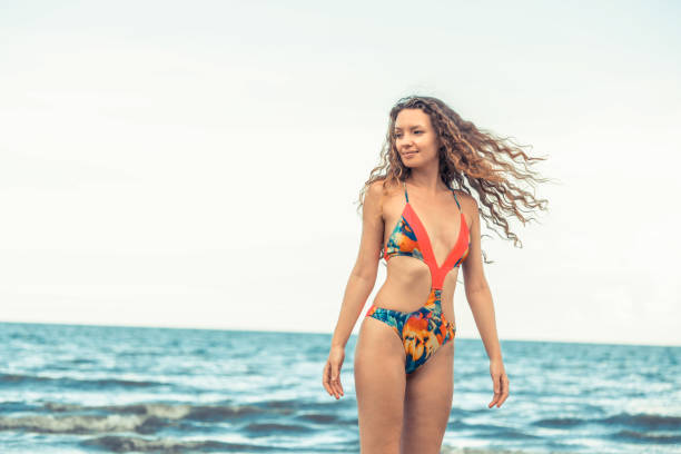 istock Happy young woman at beach in summer vacation. 1024182146