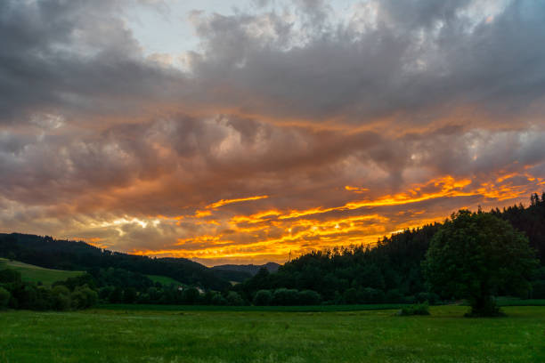 istock Germany, Red fire sunset sky over black forest nature landscape 1024182554