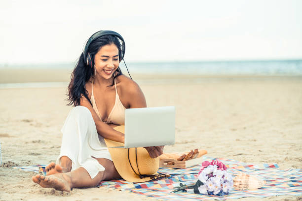 istock Plus size young woman sitting on the beach. 1024183238