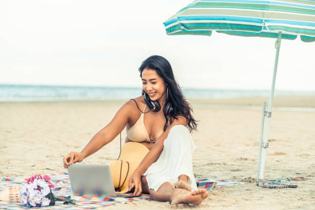 istock Plus size young woman sitting on the beach. 1024183318