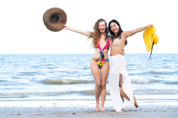 istock Happy women dance on sand beach in summer. 1024185814