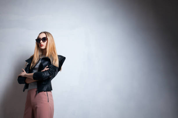 istock fashion lady in sunglasses posing in studio; 1024188656