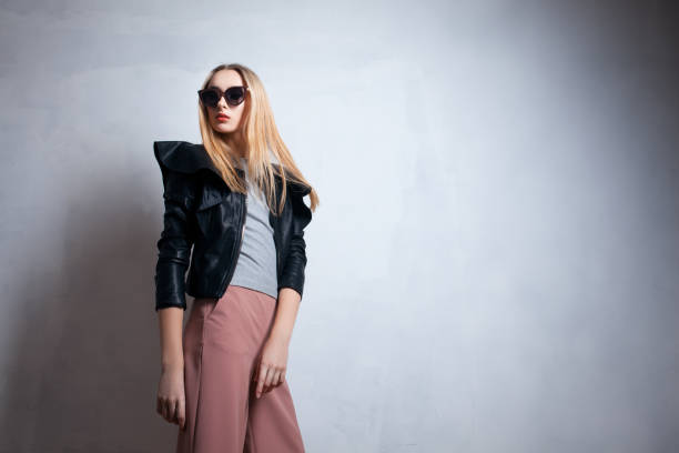 istock fashion lady in sunglasses posing in studio; 1024188674