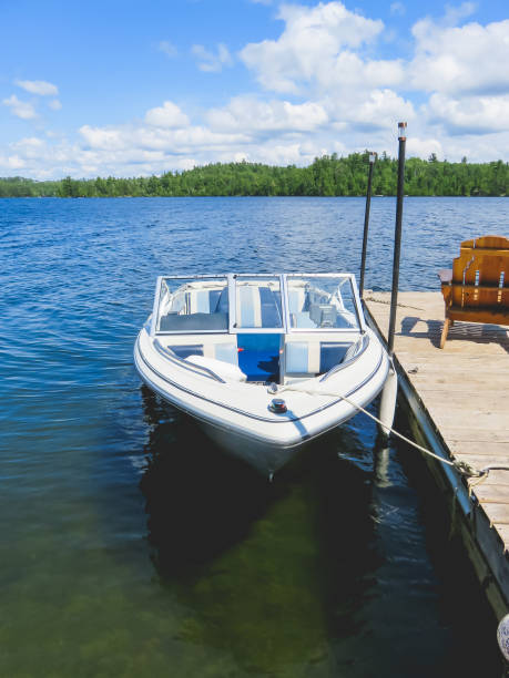 istock Blue Motorboat tied to the Dock 1024188758