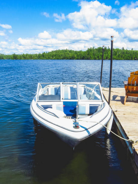 istock Blue Motorboat tied to the Dock 1024188764