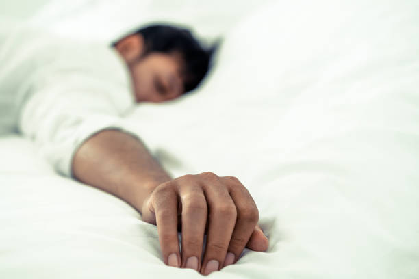 istock Young man sleep in bed in the bedroom. 1024189028