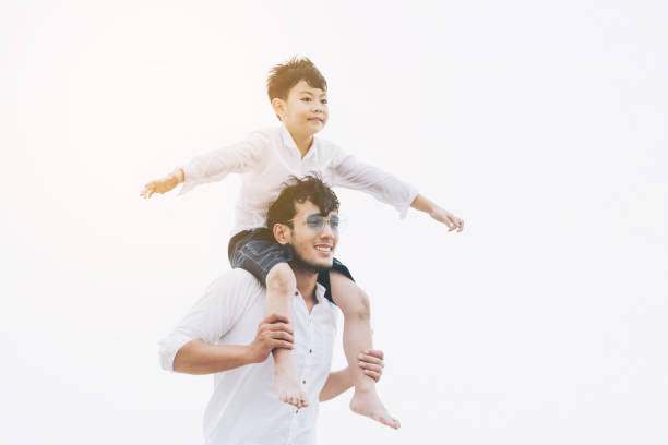 istock Happy father carrying his son on the neck. 1024189044