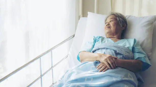 Lonely Elderly patients in hospital bed patients want to go home - medical and healthcare concept