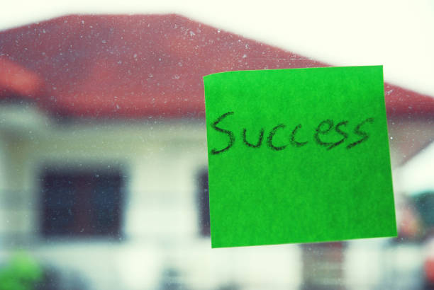 istock success words on green paper. 1024197102