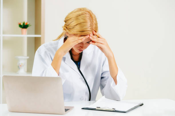 istock Serious doctor working in hospital office. 1024197160