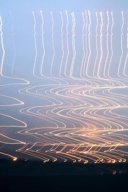 istock Zig Zag orange light trails in the sky 1024209594