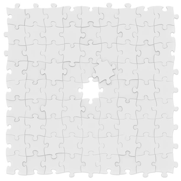 istock Jigsaw puzzles square mockup background unfinished  in centre on white, 3D rendered image 1024214870