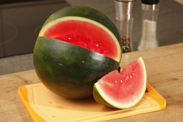 istock watermelon on a board with knife 1024223608