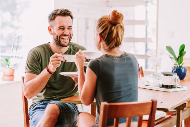 istock Young couple drinking coffee and having fun, flirting 1024230674