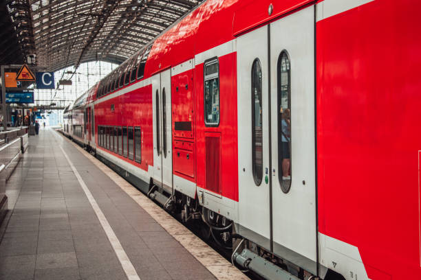 istock Red train at railroad station 1024233768