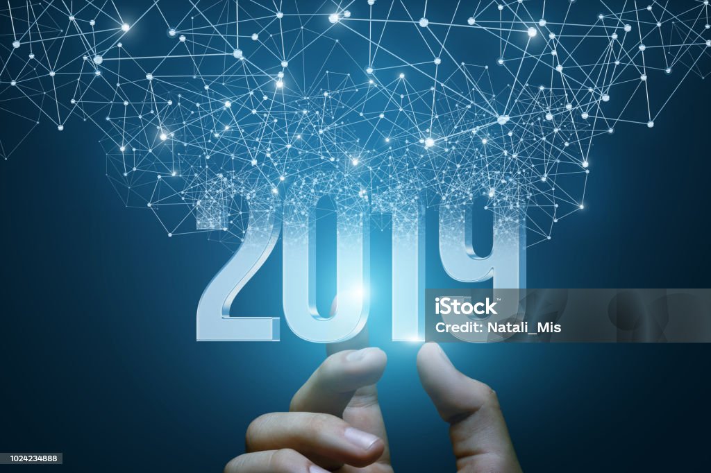 Hand shows the numbers 2019 . Hand shows the numbers 2019 emerging from the network connections. Forecasting Stock Photo