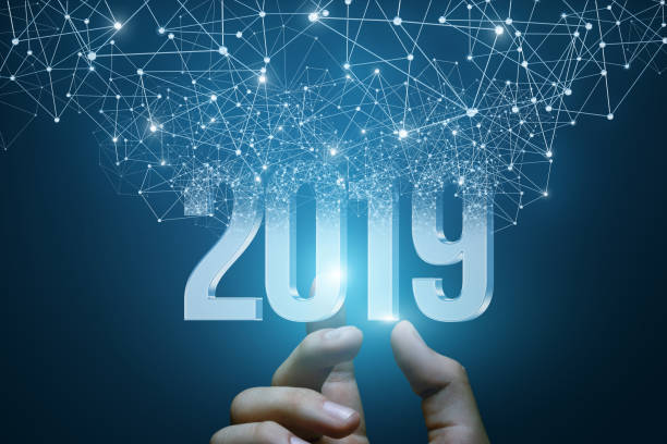 Hand shows the numbers 2019 . Hand shows the numbers 2019 emerging from the network connections. 2019 stock pictures, royalty-free photos & images