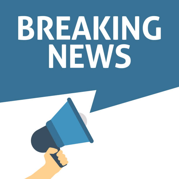 istock Hand Holding Megaphone With BREAKING NEWS Announcement 1024257274
