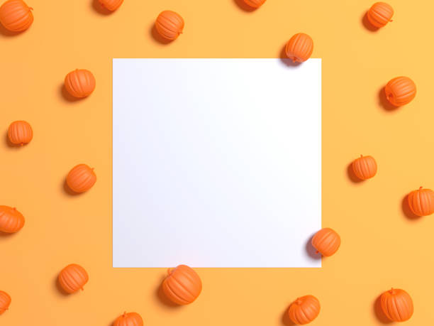 Halloween holiday background with glitter pumpkins decor. View from above. Flat lay. White Frame on a yellow background