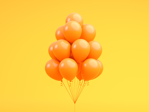 Orange balloons floating in Orange 