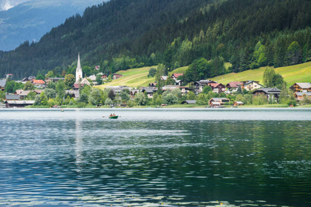 Weissensee, Austria. August 15, 2018.   a couple relaxes on a boat at Lake Weissensee, Austria