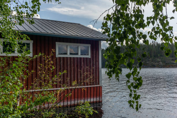 A typical red boat house  on the shore of the Saimaa lake in Finland - 2 A typical red boat house  on the shore of the Saimaa lake in Finland - 2 saimaa stock pictures, royalty-free photos & images