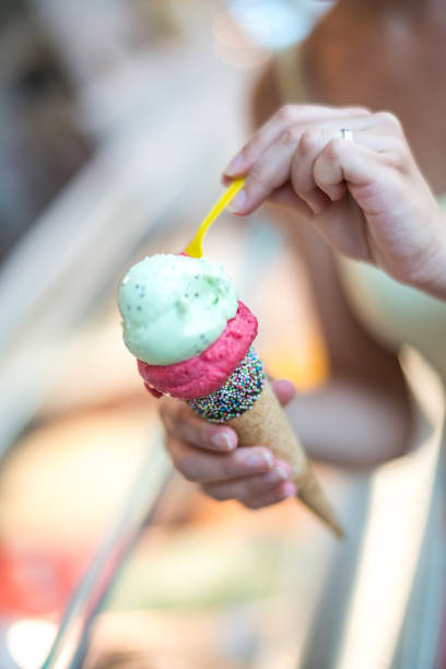 istock Young woman enjoying ice cream 1024280502