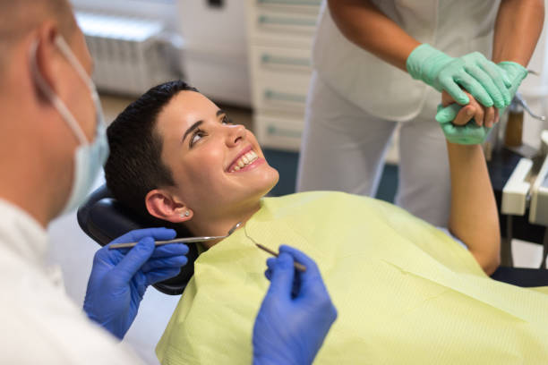 istock Young woman at the dentist 1024283990