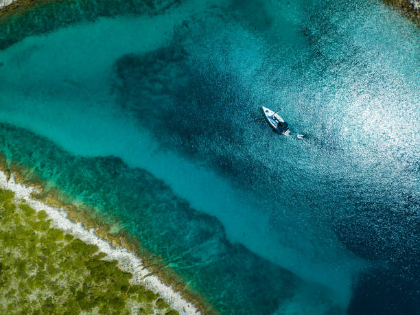 istock Anchored sailboat, view from drone 1024296558
