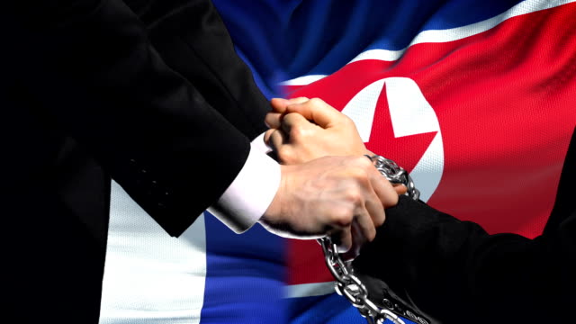 France sanctions North Korea, chained arms, political or economic conflict