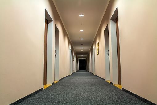 Photo of empty passageway corridor in luxury house.