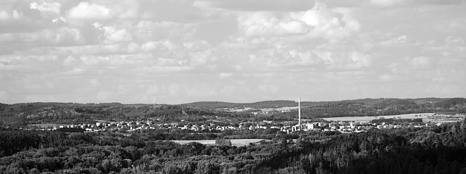 Monochromatic landscape of South Bohemia with Strakonice city between forests on 11th august 2018 during summer afternoon