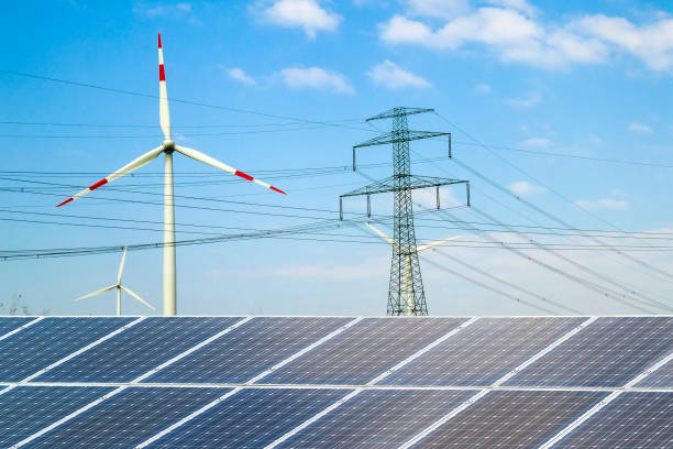 istock Solar panels against wind turbines. Sustainable development and renewable resources concept. 1024336214