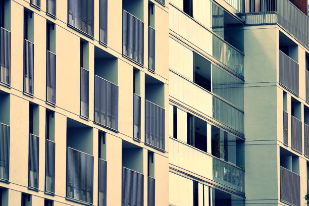 istock Modern apartment building exterior. Retro colors stylization 1024339674