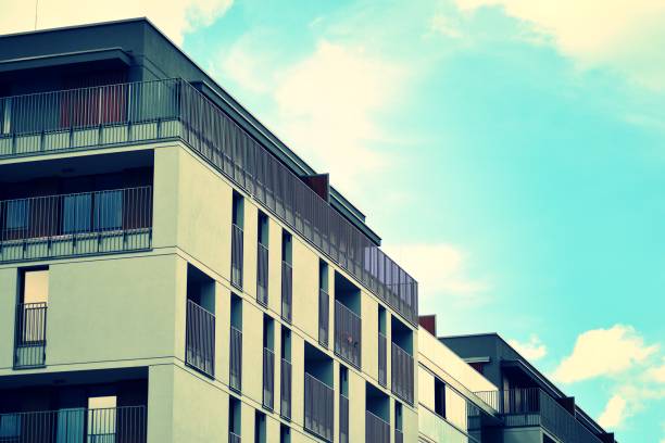 istock Modern apartment building exterior. Retro colors stylization 1024339738