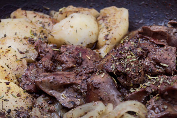 istock Stewed liver with apples and onions close-up. 1024339766