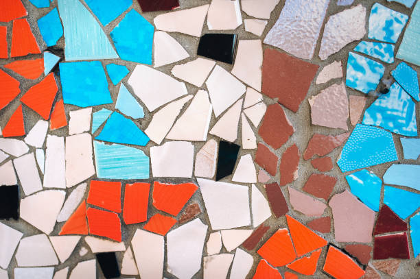 istock Multicolor mosaic wall decorative ornament from ceramic broken tile. Barcelona, Catalonia. 1024339782